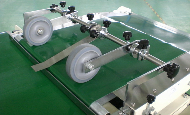 Pressure Wheels apply pressure to paper stream